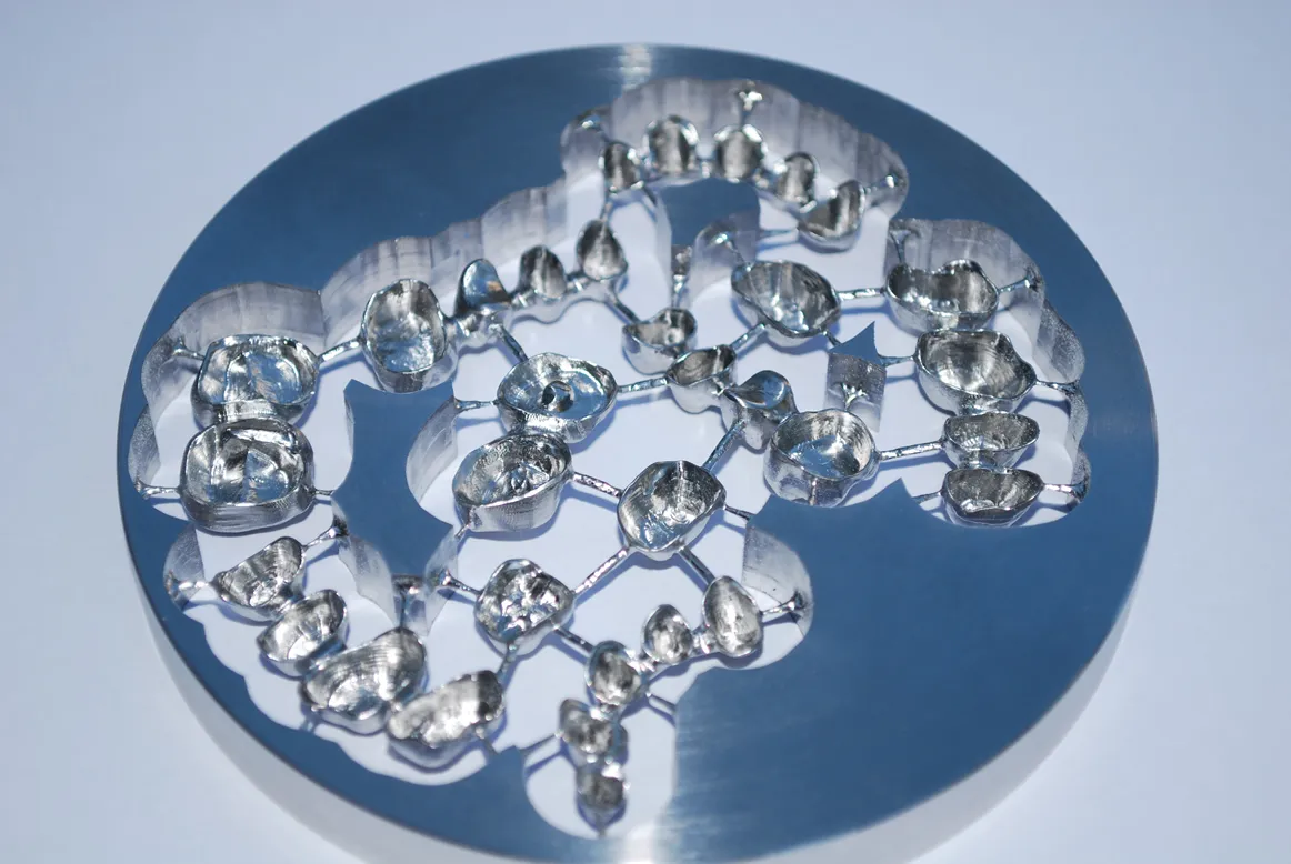 Implant crowns milled from a metal disc for screw-retained restorations